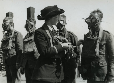 A picture of army recruits in weird masks, standing in line,  being inspected